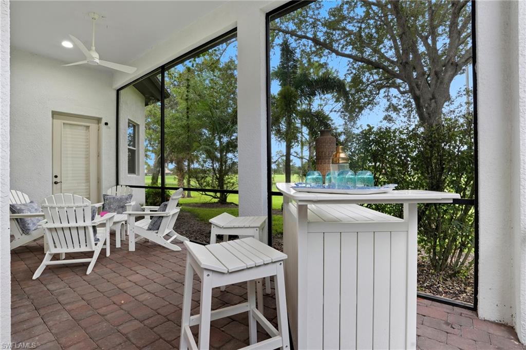 7840 Valencia Court Naples, FL 34113 - Photo 18 of 24 Sunroom / solarium with a patio and a ceiling fan