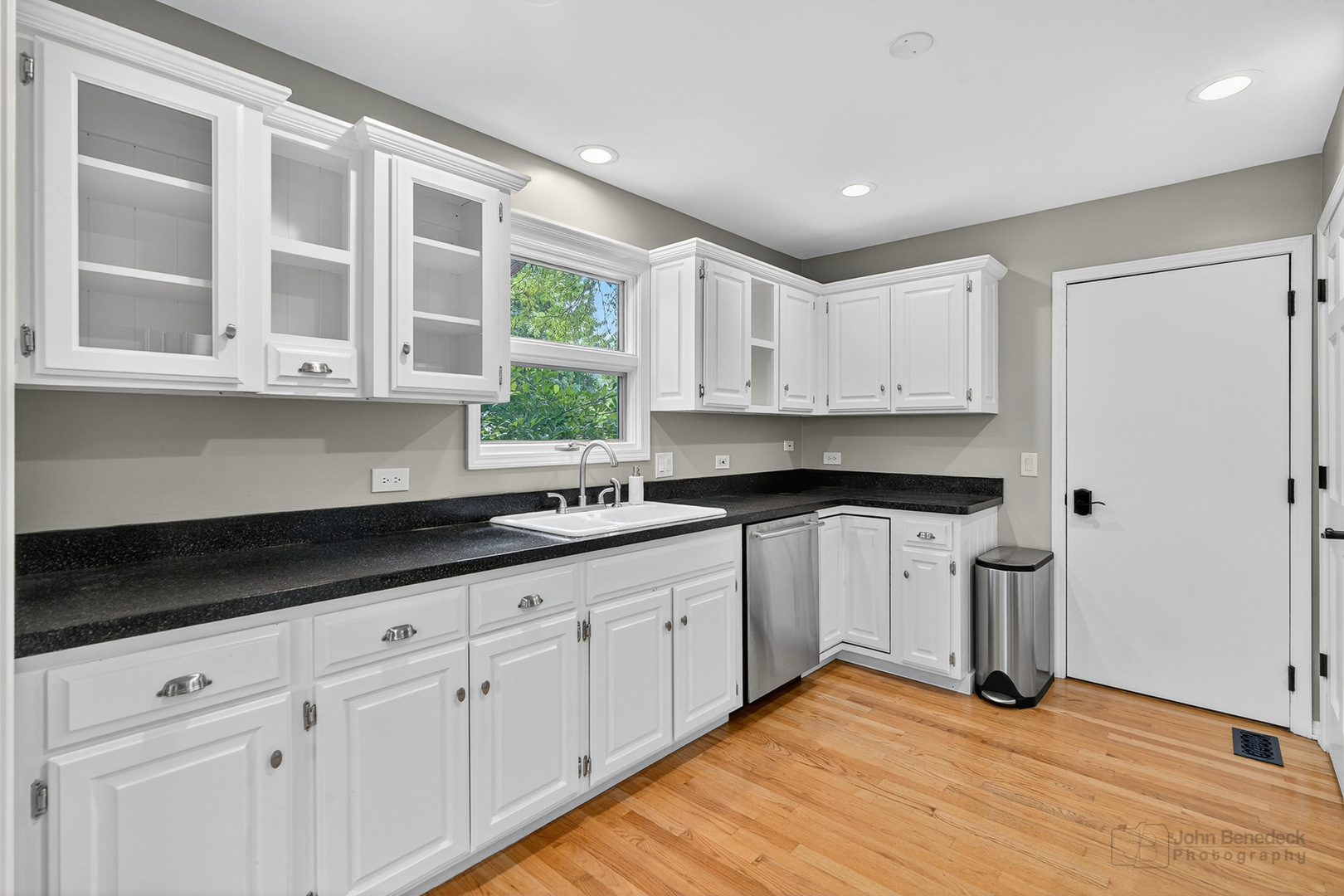 232 Long Hill Road Gurnee, IL 60031 - Photo 12 of 34 a kitchen with stainless steel appliances granite countertop a sink and cabinets with wooden floor