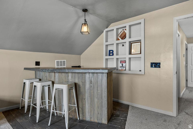 225 Falcon Court Ivins, UT 84738 - Photo 25 of 47 Indoor dry bar with vaulted ceiling and pendant lighting
