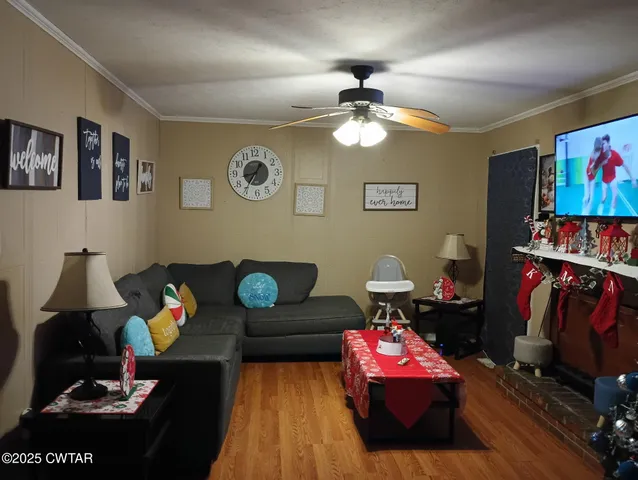 a living room with furniture and a flat screen tv