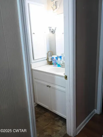 a bedroom with a bed and a table