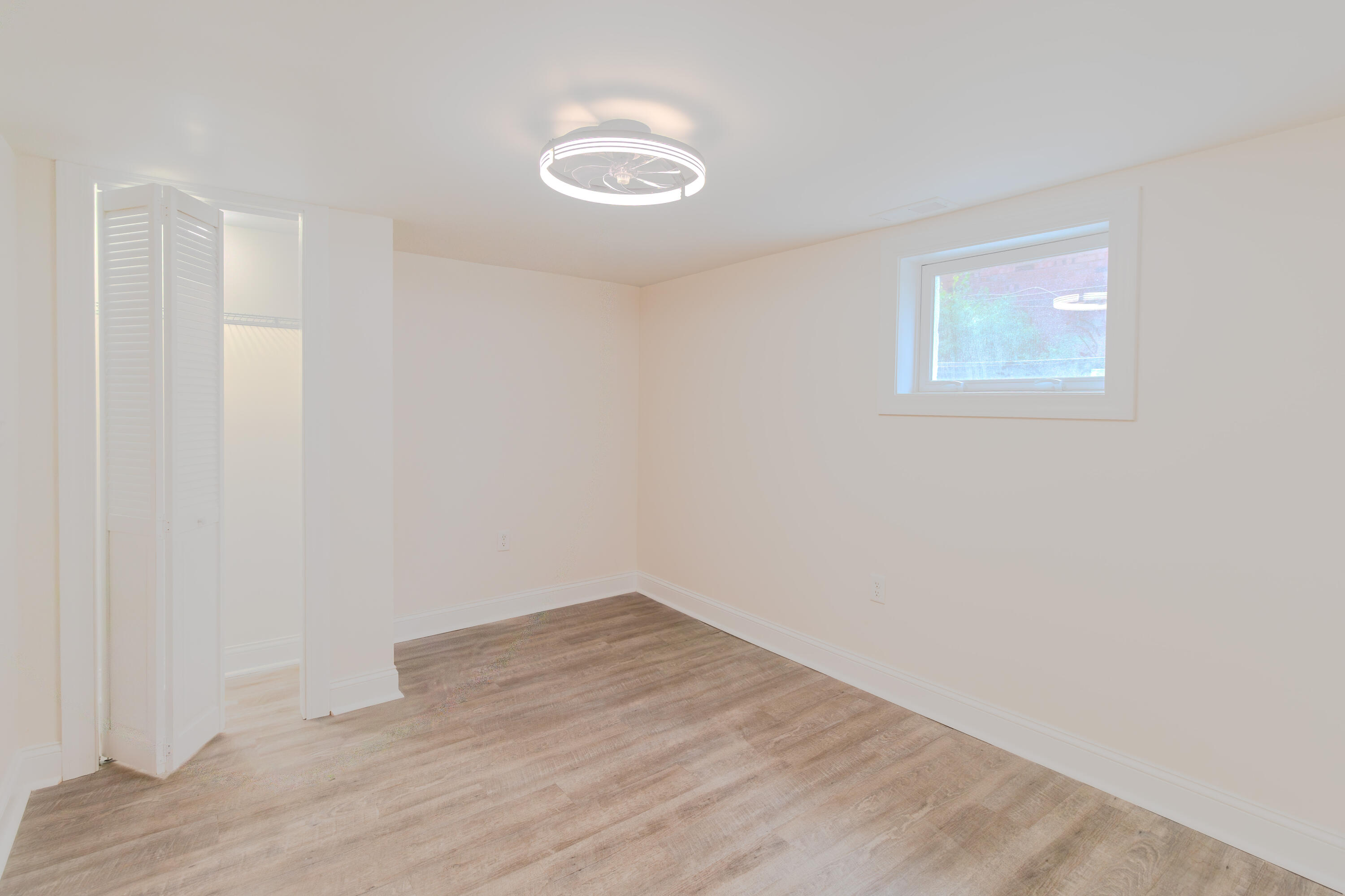 3678 Jackson Street Gary, IN 46408 - Photo 21 of 27 a view of a room with wooden floor and white walls