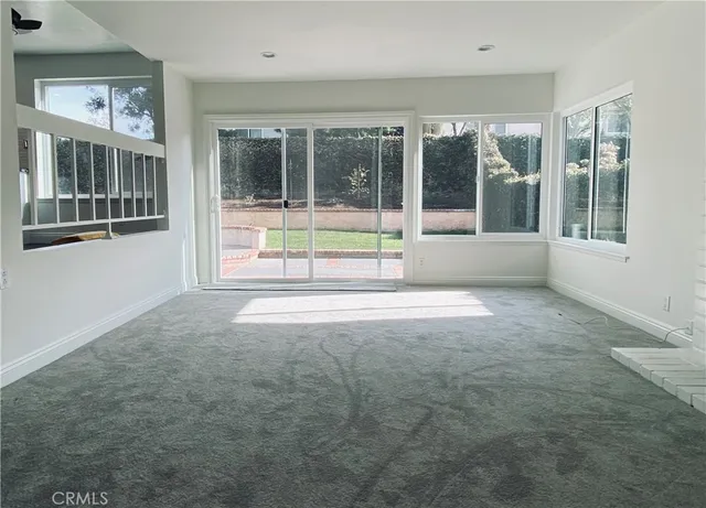 a view of an empty room with a large window