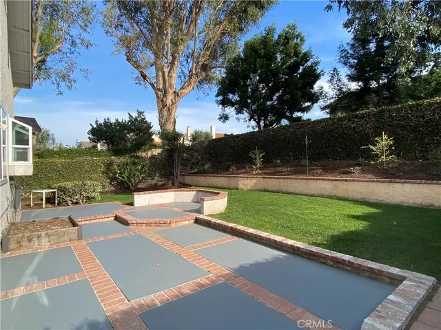 a view of a house with backyard porch and sitting area