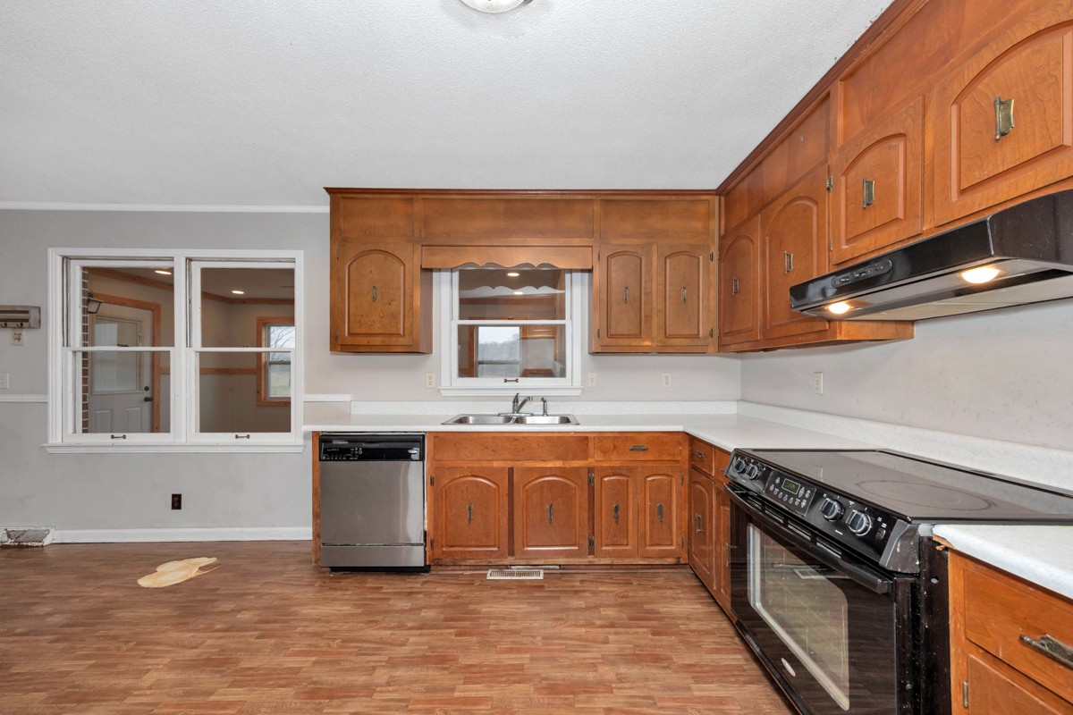 2117 Ardmore Highway Ardmore, TN 38449 - Photo 12 of 32 a kitchen with stainless steel appliances granite countertop a sink stove and cabinets