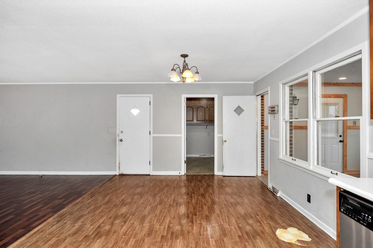 2117 Ardmore Highway Ardmore, TN 38449 - Photo 14 of 32 wooden floor in an empty room with a window