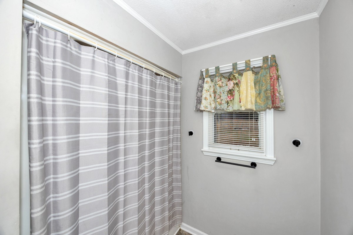 2117 Ardmore Highway Ardmore, TN 38449 - Photo 20 of 32 a bathroom with a shower and a window