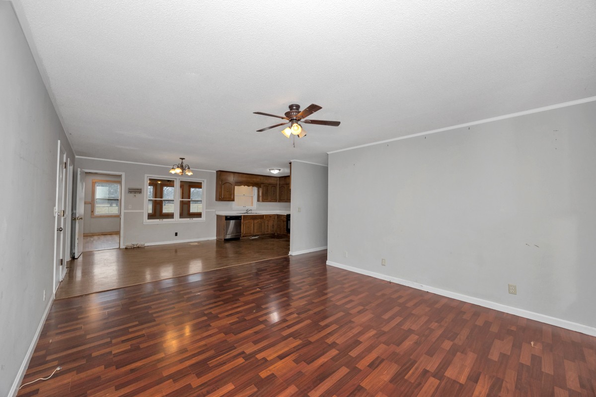 2117 Ardmore Highway Ardmore, TN 38449 - Photo 8 of 32 a view of an empty room with wooden floor and a window