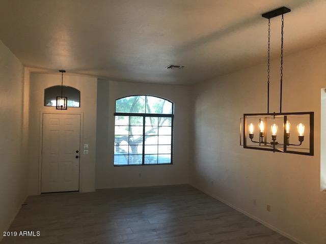 4206 East Rowel Road Phoenix, AZ 85050 - Photo 5 of 16 Tiled Living/Dining Area