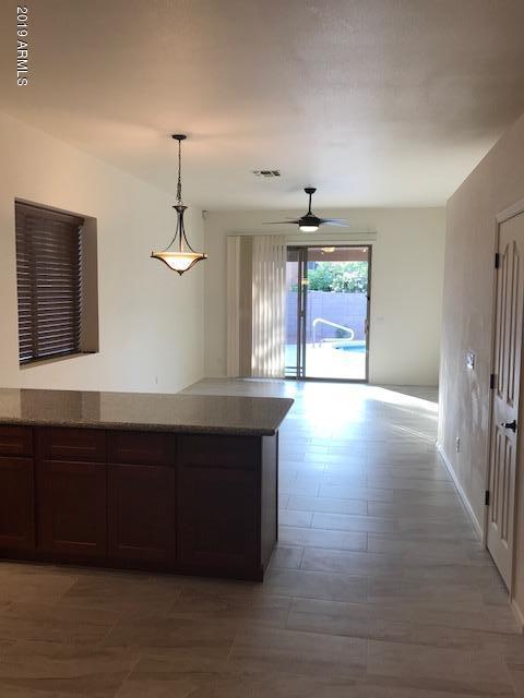 4206 East Rowel Road Phoenix, AZ 85050 - Photo 7 of 16 Kitchen looks out to Family Room