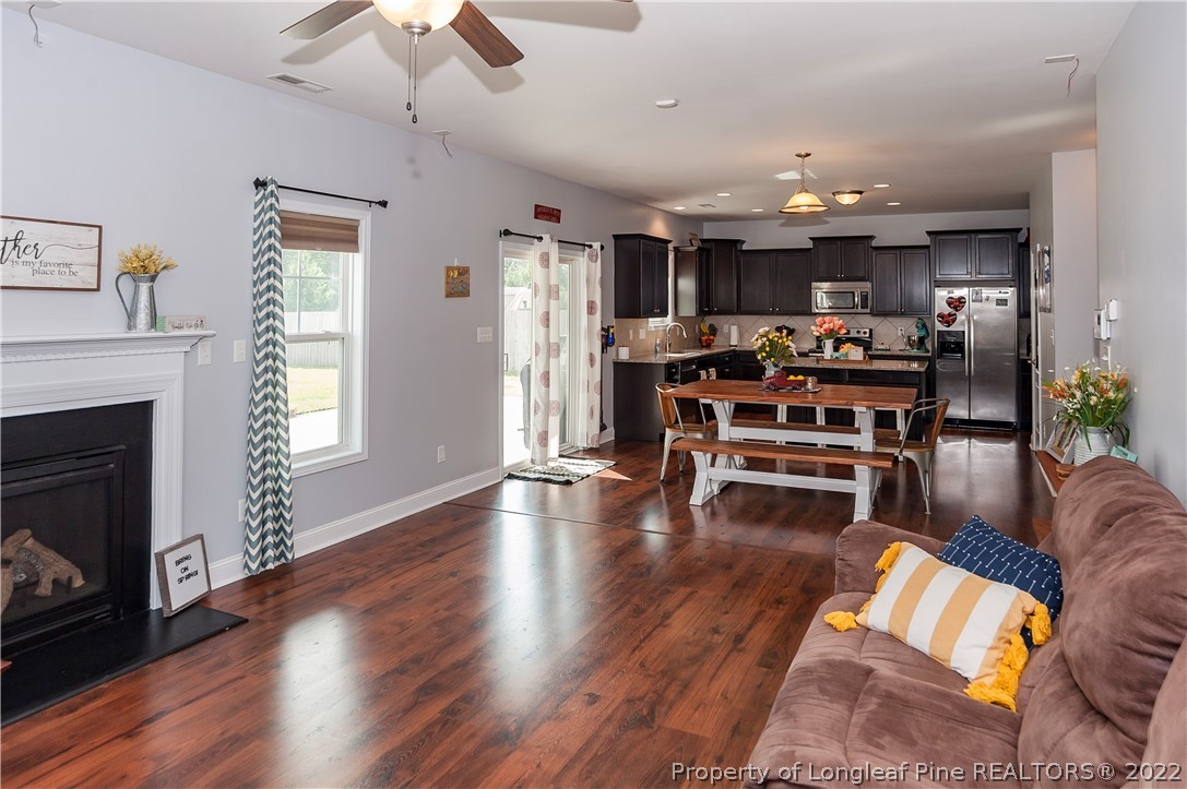 461 St Johns Loop Raeford, NC 28376 - Photo 15 of 50 a living room with furniture and a fireplace