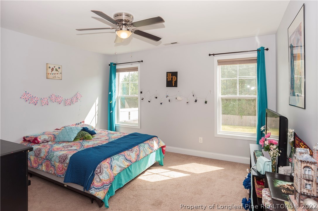 461 St Johns Loop Raeford, NC 28376 - Photo 38 of 50 a bedroom with a bed and a window