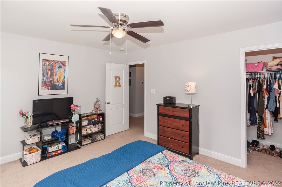 461 St Johns Loop Raeford, NC 28376 - Photo 40 of 50 a bedroom with a bed and furniture