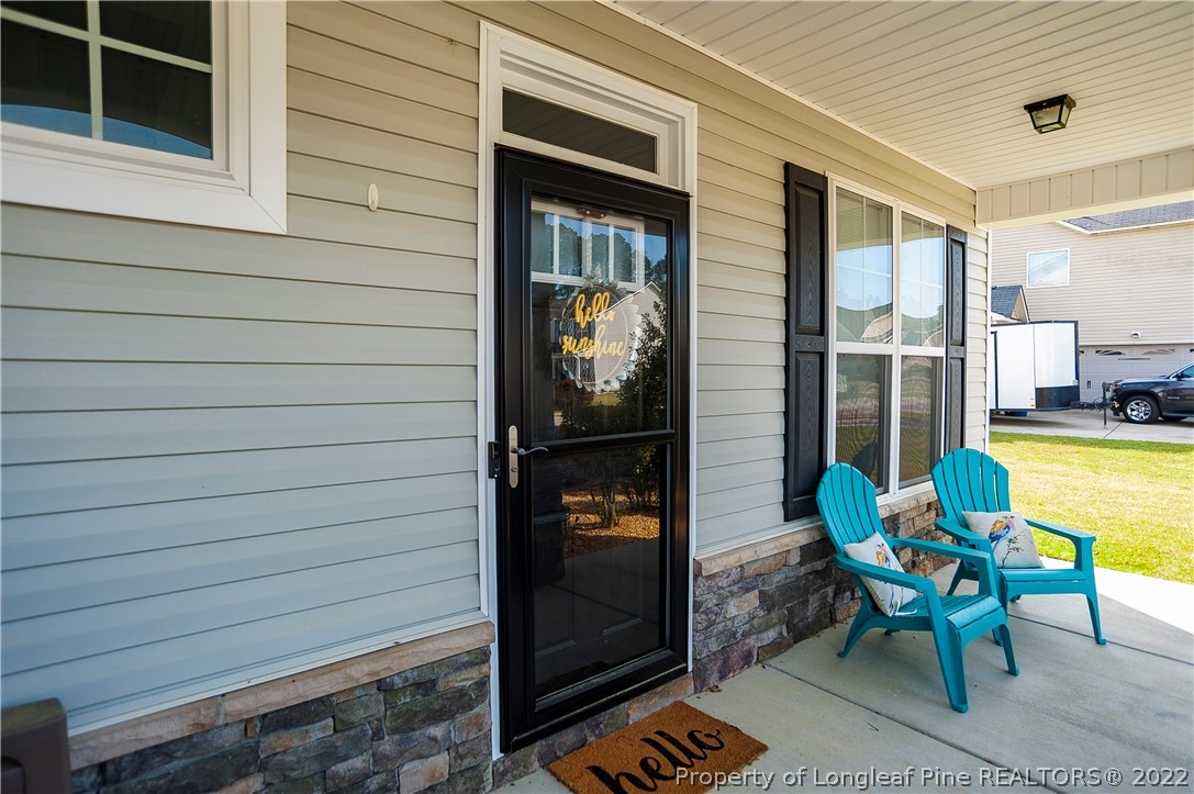 461 St Johns Loop Raeford, NC 28376 - Photo 4 of 50 a porch with seating space and entryway