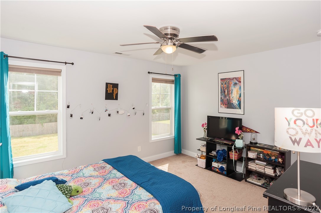 461 St Johns Loop Raeford, NC 28376 - Photo 41 of 50 a bedroom with bed and a window