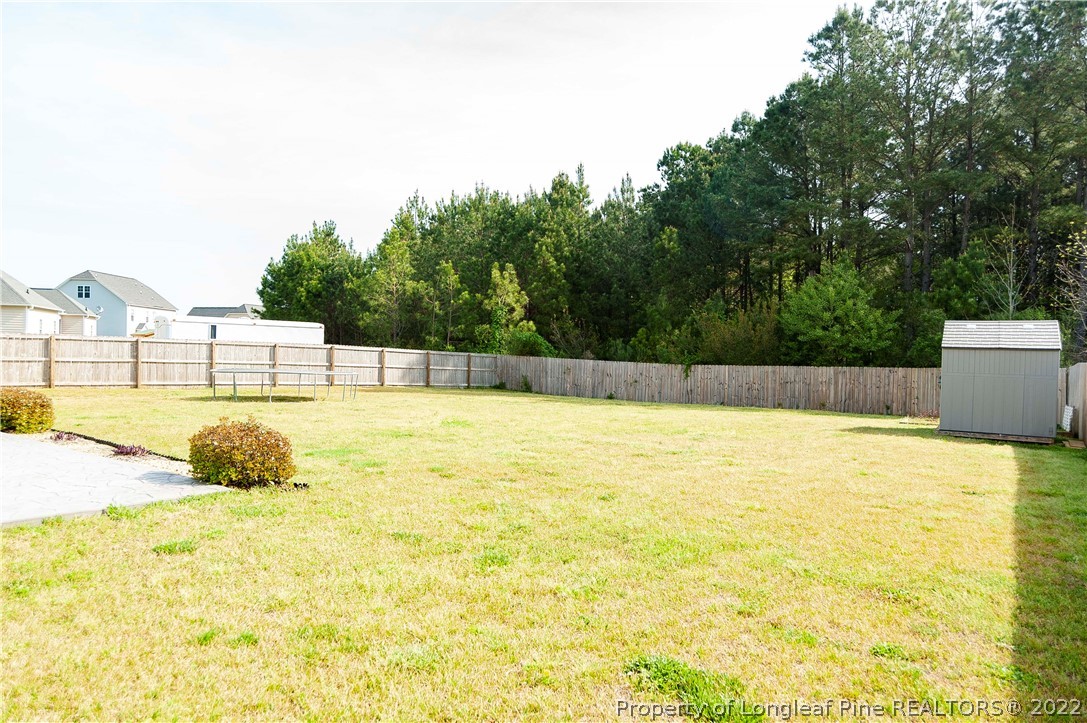 461 St Johns Loop Raeford, NC 28376 - Photo 6 of 50 a swimming pool that is in the water next to a yard