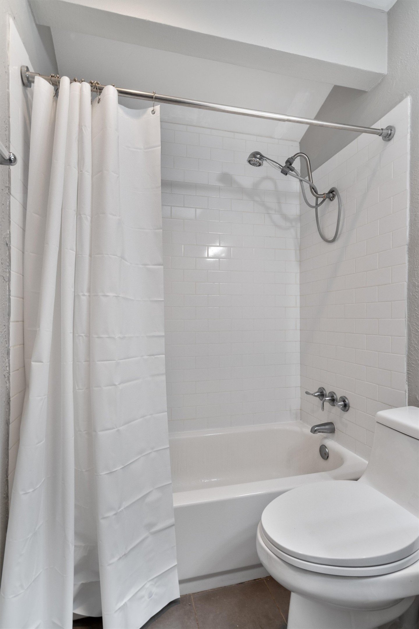 3415 Menchaca Road, Unit 113 Austin, TX 78704 - Photo 14 of 21 a bathroom with a toilet and a shower