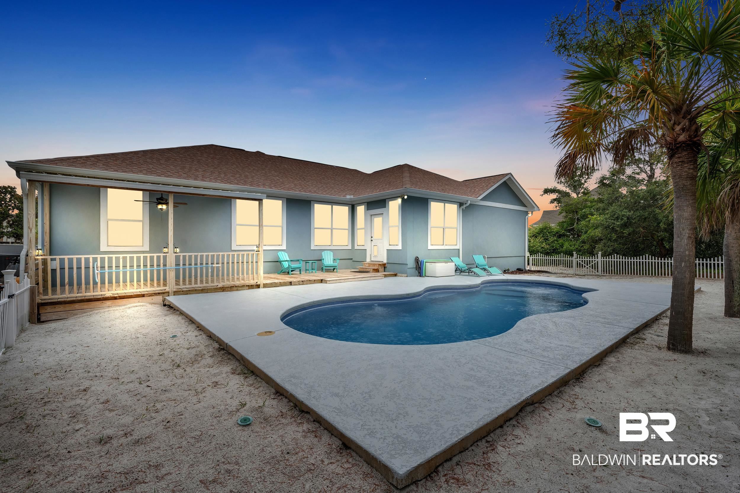 4606 Osprey Drive Orange Beach, AL 36561 - Photo 9 of 44 View of swimming pool with a fenced backyard, a ceiling fan, and a patio area