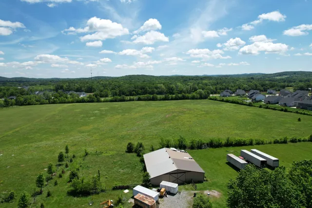 an aerial view of a house with a garden