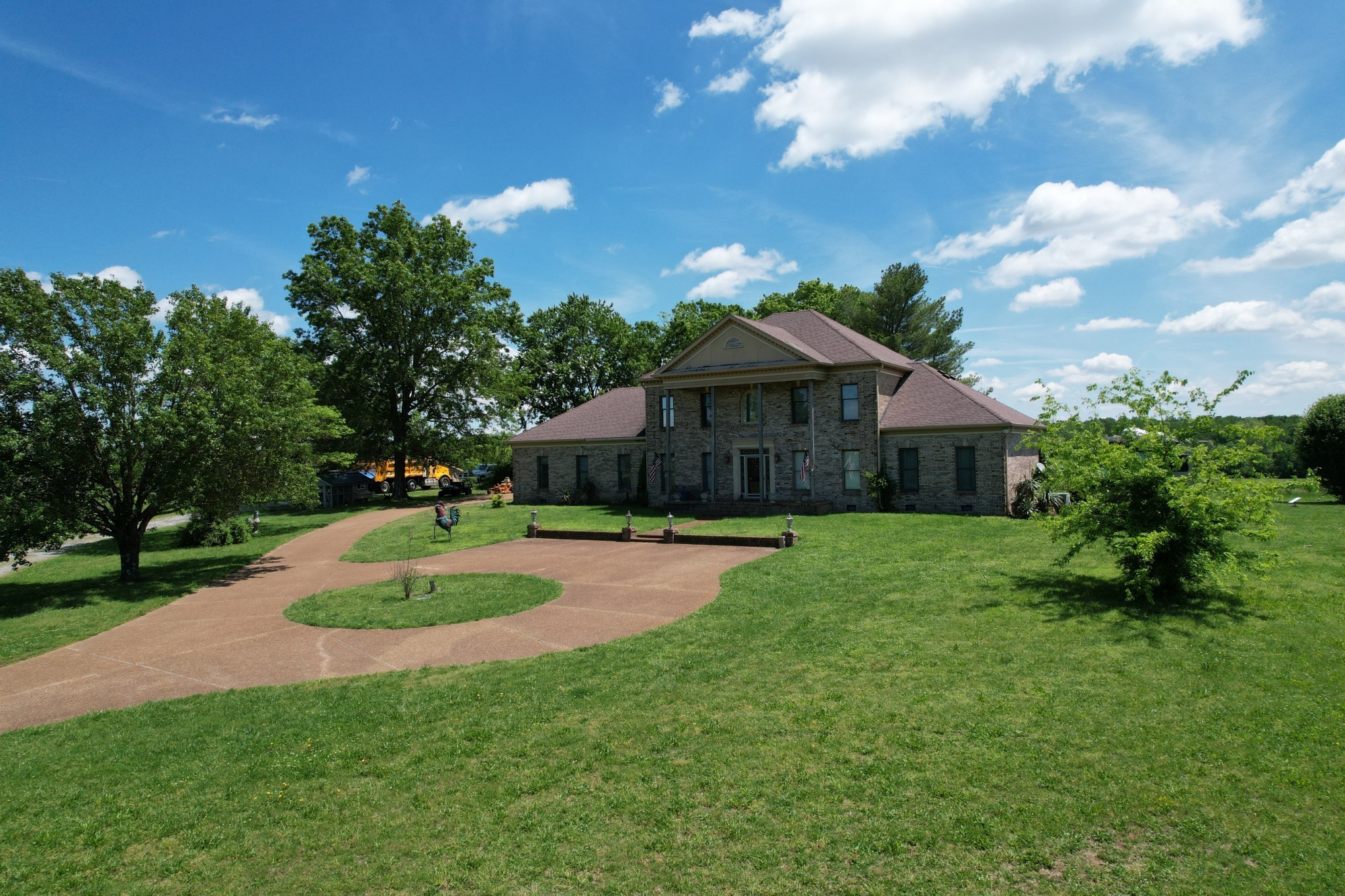 6286 Cox Road Arrington, TN 37014 - Photo 7 of 21 a front view of a house with a yard fire pit and outdoor seating