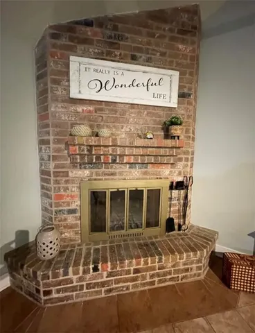 a view of a fireplace with washer and dryer
