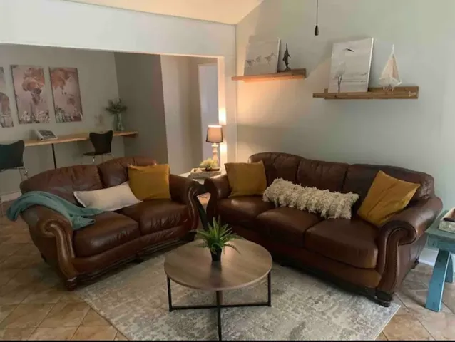 a living room with furniture and a couch