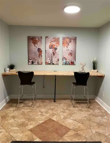 a view of a workspace with furniture