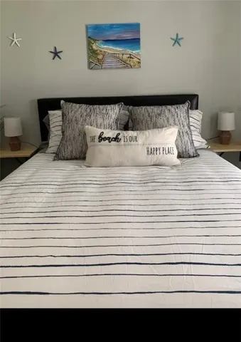 a picture of a bedroom with a bed