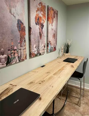 a view of wooden floor and a potted plant on a table