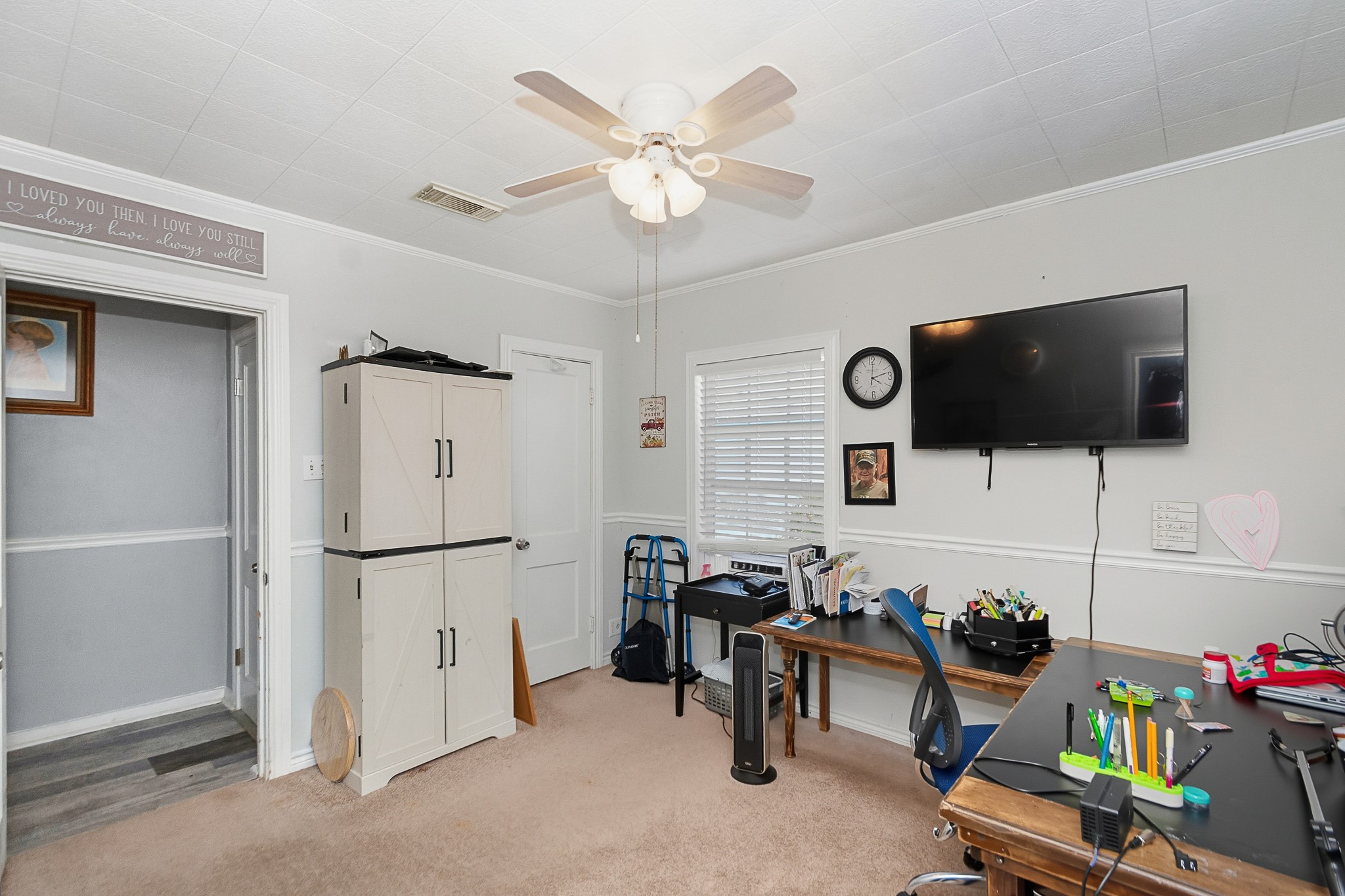 1406 West 6th Street Freeport, TX 77541 - Photo 15 of 25 a living room with furniture and a flat screen tv