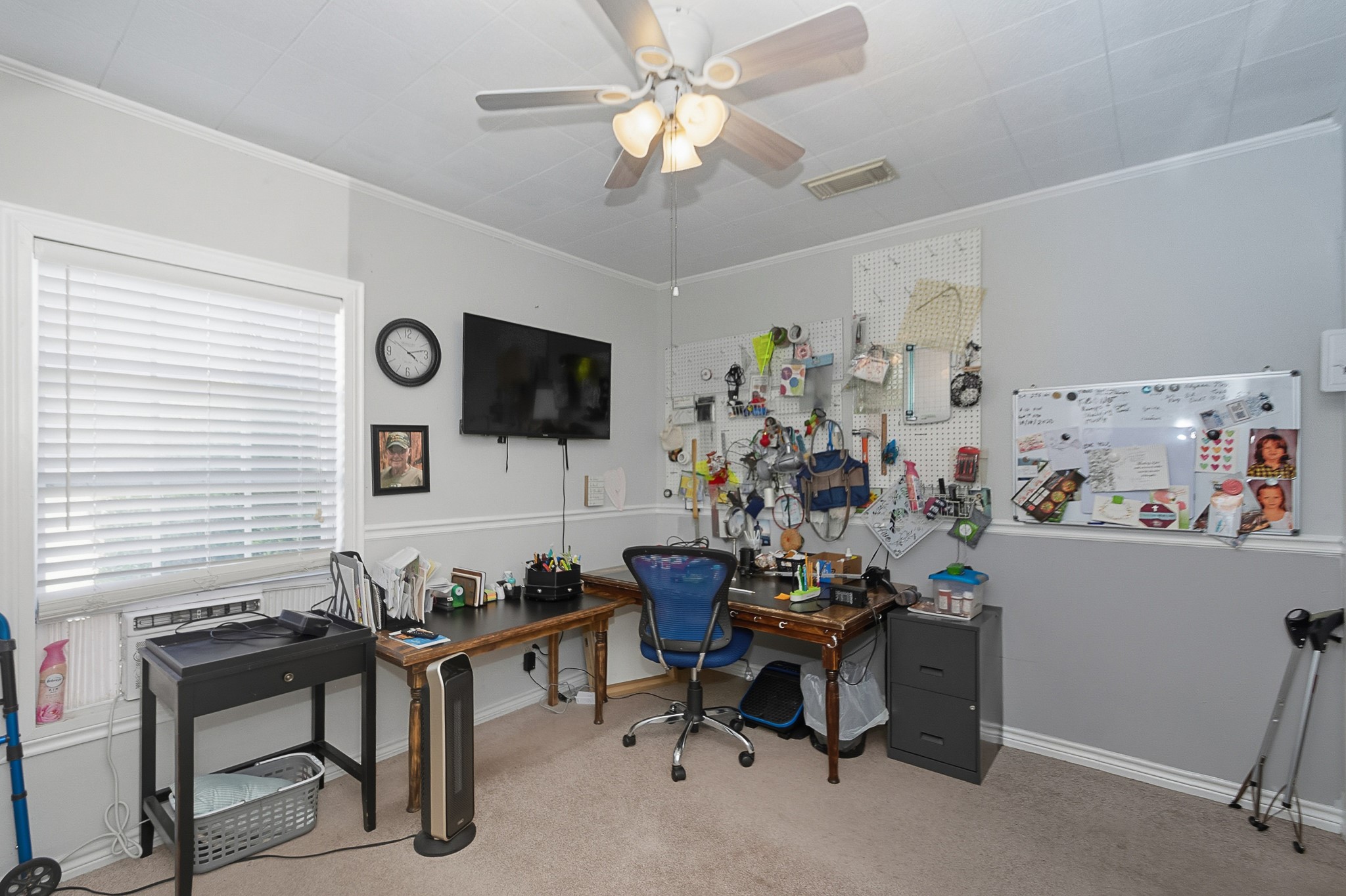 1406 West 6th Street Freeport, TX 77541 - Photo 16 of 25 a living room with furniture and a flat screen tv