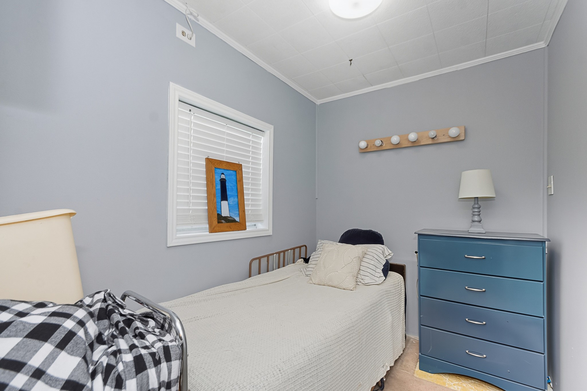 1406 West 6th Street Freeport, TX 77541 - Photo 17 of 25 a bedroom with a bed and a window