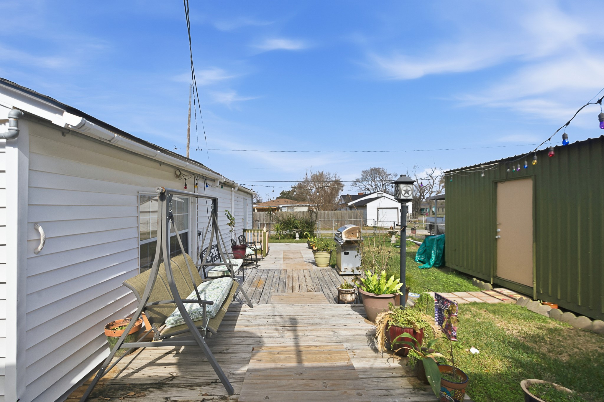 1406 West 6th Street Freeport, TX 77541 - Photo 22 of 25 a view of a patio with table and chairs and potted plants