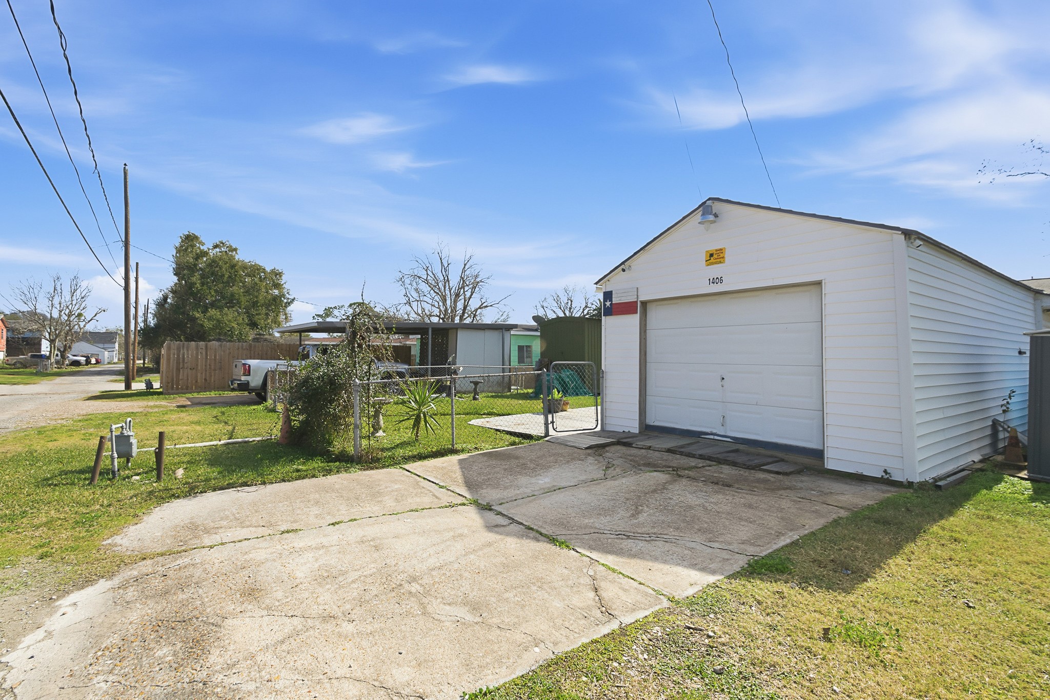 1406 West 6th Street Freeport, TX 77541 - Photo 25 of 25 a view of a house with backyard and sitting area