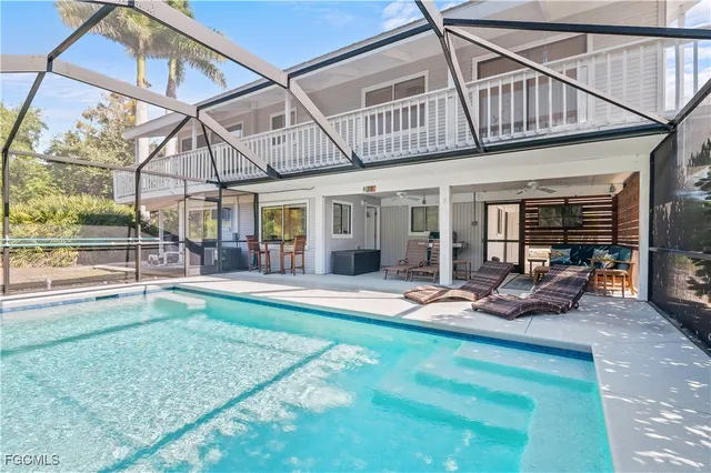 a view of a backyard with table and chairs
