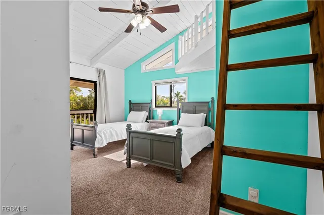 a living room with a bed furniture and a window