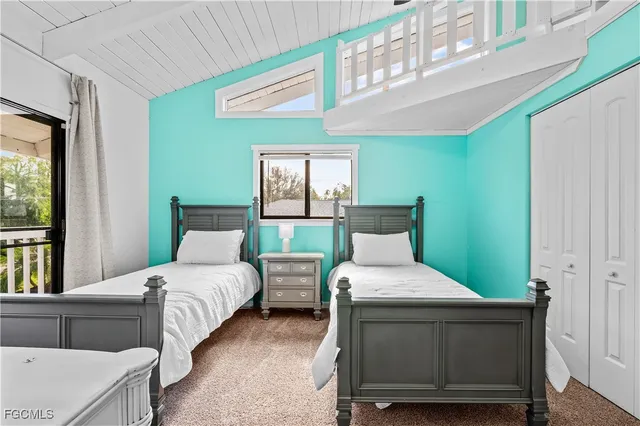 a bathroom with a sink a toilet and shower curtain