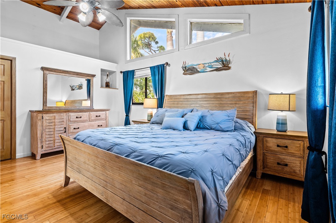 14171 Bokeelia Road Bokeelia, FL 33922 - Photo 19 of 25 a bed sitting in a bedroom next to a window