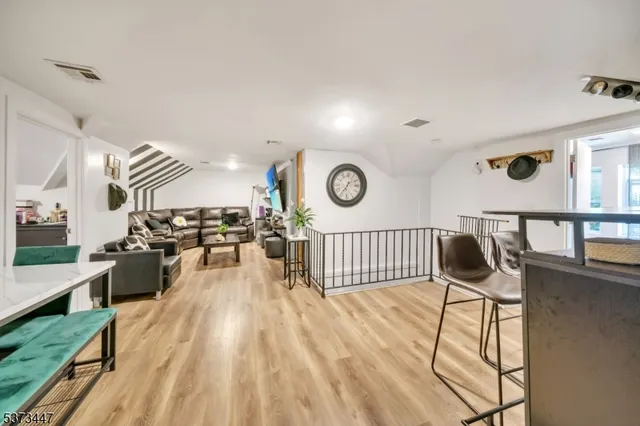 a view of a living room and dining room