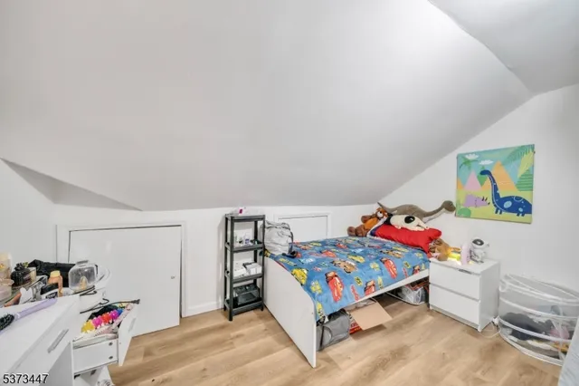 a bedroom with furniture and a bed