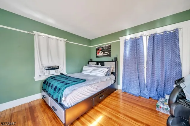 a bedroom with a bed and a mirror