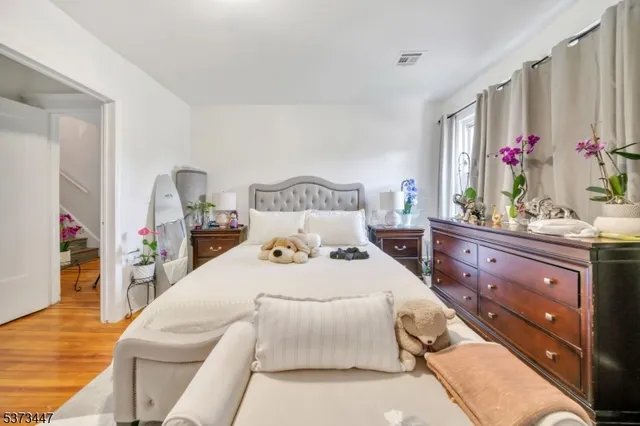 a bedroom with a bed and a dresser