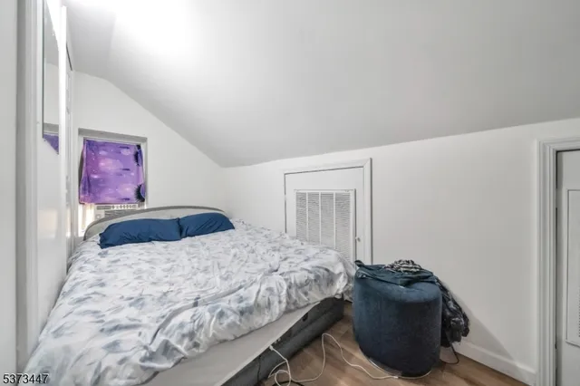 a bedroom with a bed and dresser