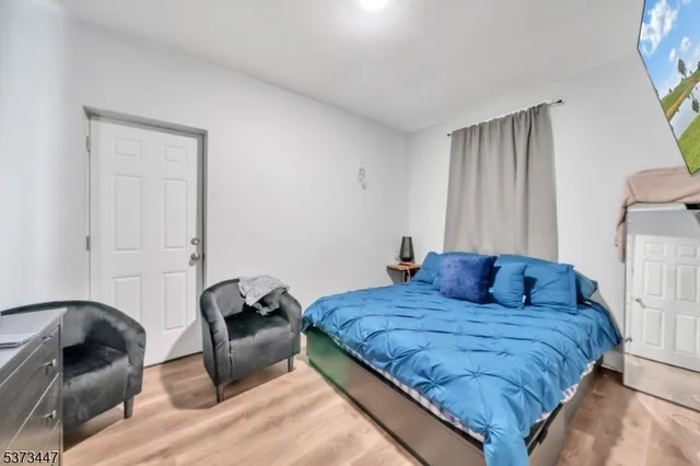 a bedroom with a bed and a couch