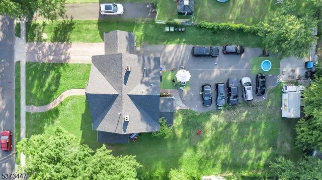 an aerial view of a house with a garden