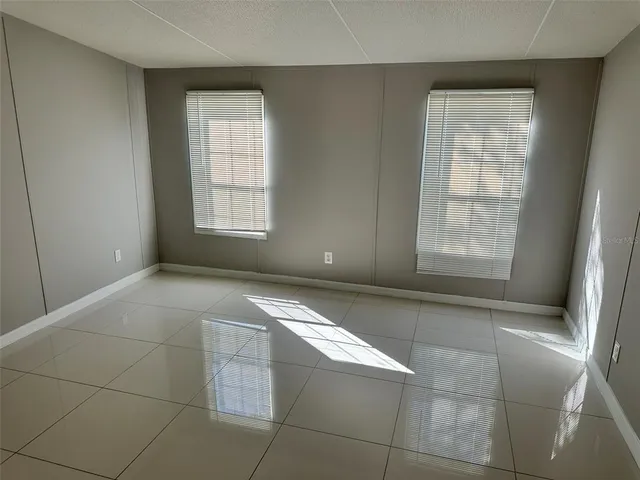 a view of an empty room with a window