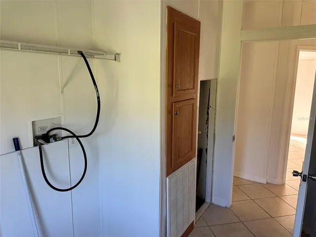 a bathroom with a mirror and a glass door