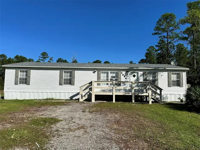 front view of a house with a small yard