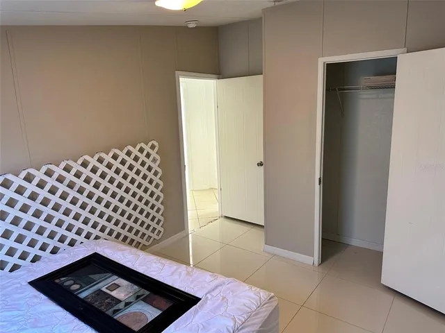 a view of hallway with wooden floor