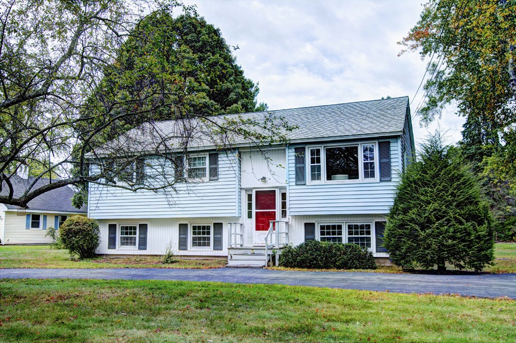 12 Mill Road Chelmsford, MA 01824 - Photo 1 of 11 a front view of a house with a yard